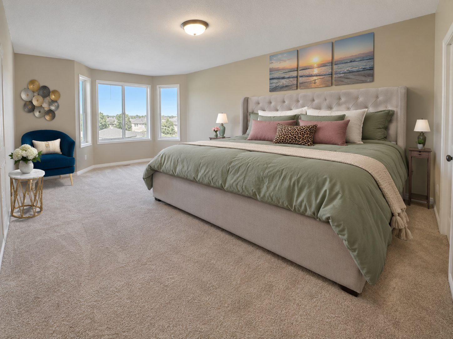 Virtually staged bedroom dominated by an oversized bed and tall upholstered headboard