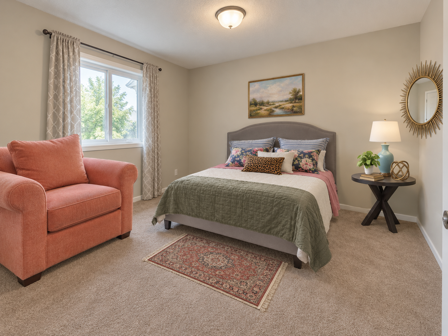 Virtually staged small bedroom with a large pink armchair and a mirror reflecting mismatched architecture